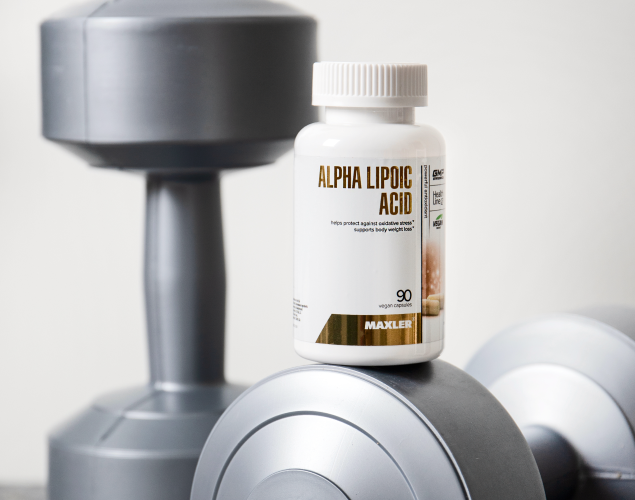 A picture of Alpha Lipoic Acid capsules standing on dumbbells.