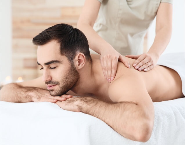 A girl is making massage for a man