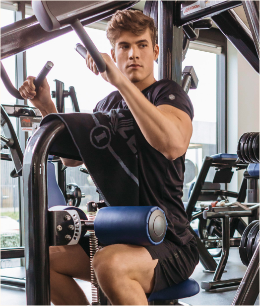 A photo of a man in a gym training.