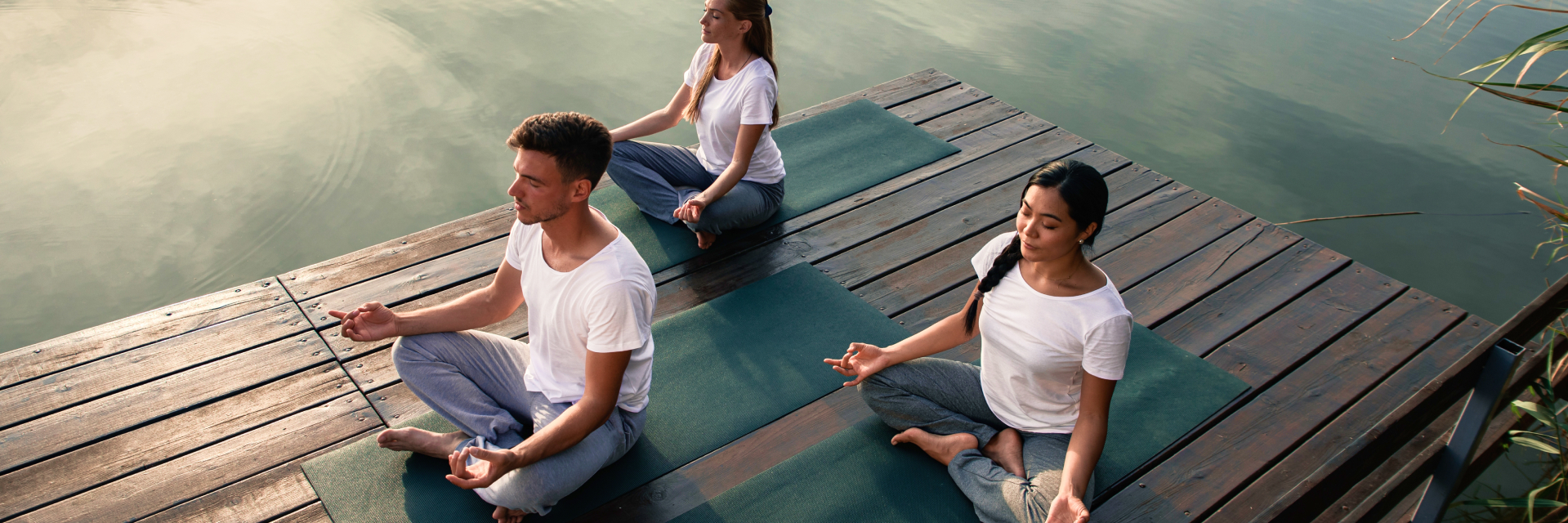 A photo of group of people meditating.